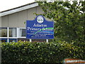 TM1591 : Aslacton Primary School sign by Geographer