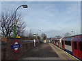 TQ4490 : An Underground train leaves Fairlop station by Marathon