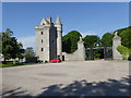 NJ7808 : Southern tower house and gated entrance to the Dunecht House Estate by Stanley Howe