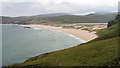 NC2164 : Grassy slope with Sandwood Bay beyond by Trevor Littlewood