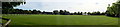 TF0246 : Panorama of field opposite church by Bob Harvey