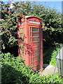 SJ3079 : Disused telephone box, Upper Raby Road by Jeff Buck