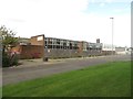 NZ3464 : Disused industrial building off Newcastle Road by Graham Robson