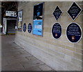 SJ3250 : Six blue plaques on the wall of platform 1, Wrexham General railway station by Jaggery