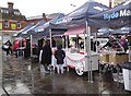 SJ9494 : Traders setting up in the rain by Gerald England