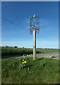 TM3575 : Cookley Village sign by Geographer