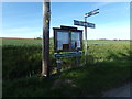 TM3575 : Cookley Village Notice Board & Signpost by Geographer