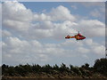 TL8427 : The Essex & Herts Air Ambulance about to land by Geographer