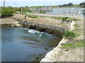 SW5537 : Carnsew Pool discharging through the sluices by Chris Allen