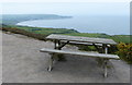 NZ9701 : Picnic bench and a view of Robin Hood's Bay by Mat Fascione