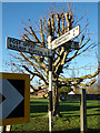 TM4897 : Signpost on The Street by Geographer