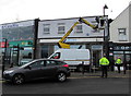 ST1586 : Removing a Christmas decoration from the lamppost outside Barclays Bank, Caerphilly by Jaggery