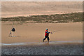 NU0052 : A sea angler at Sandstell Point by Walter Baxter