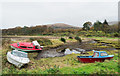 NN0801 : Small boats at the shore of Strachur Bay by Trevor Littlewood