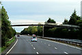 NS3240 : Footbridge over the A78 near Knadgerhill Cemetery by David Dixon