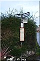 SJ2028 : Fingerpost and Bus Stop by Bob Harvey