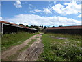 TM2538 : Disused farm buildings at Morston Hall by Chris Holifield