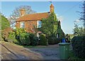 SK6991 : Roe Hill Cottage and a green wheelie bin by Neil Theasby