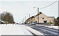 NZ1735 : Snow blowing on to road at High Job's Hill by Trevor Littlewood