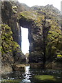 NJ5767 : Natural arch near Redhythe Point by Nigel Feilden