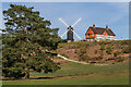 TQ2350 : Reigate Heath Windmill and Reigate Heath Golf Club clubhouse  by Ian Capper