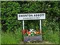 TG2726 : Swanton Abbott Village Road Sign by David Pashley