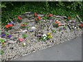 NZ2960 : Wardley Wombles flower bed by Oliver Dixon