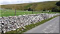 SD8970 : Moorland road heading towards Darnbrook House by Roger Templeman