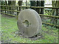 TM3154 : Millstone on the verge at Loudham Mill by Adrian S Pye