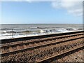 NX9719 : Railway and sea, Redness Point by Adrian Taylor