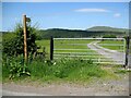 NY2432 : Gate and Stile near Peter House Farm by Adrian Taylor