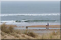 NZ2795 : Dog walker, Druridge Bay by Jim Barton