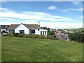 NK0328 : Bungalow on clifftop at Collieston by Oliver Dixon