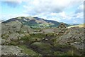 NY3021 : High Rigg summit by Graham Robson