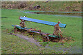 NT2440 : Park bench with debris by Jim Barton