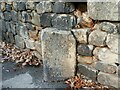 SE2436 : Old milestone on the A65 at Hawksworth Wood by Stephen Craven