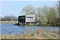 SU0436 : Birdwatching hide on East Clyffe Pond by David Martin