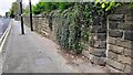 SE2737 : Wall and pavement on NE side of Otley Road by Roger Templeman