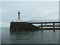 NU2705 : Fishing off the end of Amble's south jetty by Christine Johnstone