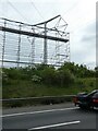 ST4874 : Netting, scaffolding and new power lines by M5 west of Portbury by David Smith