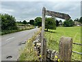 SK1970 : Tired footpath sign by David Lally