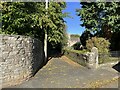 NY3239 : Path beside St. Kentigerns Church by Adrian Taylor