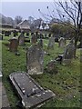 ST2796 : Churchyard headstones on a slope in Upper Cwmbran by Jaggery