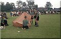 SJ7686 : Tent pitching by Geoffrey William Sutcliffe