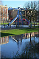 SJ9123 : Playground equipment reflected in River Sow, Stafford by Rod Grealish