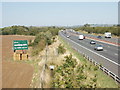 SP6208 : Billboard advertising by M40 motorway, near Waterperry Common by David Hawgood