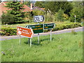 TM4496 : Roadsigns on the A143 Beccles Road by Geographer