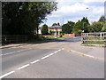 TM4360 : B1069 Leiston Road & Knodishall Village Sign by Geographer