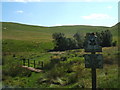 SK1056 : National Trust  sign, Wetton Hill, and footbridge over boggy ground by Peter Barr