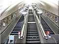 TQ2570 : Escalators at South Wimbledon station by Stephen Craven